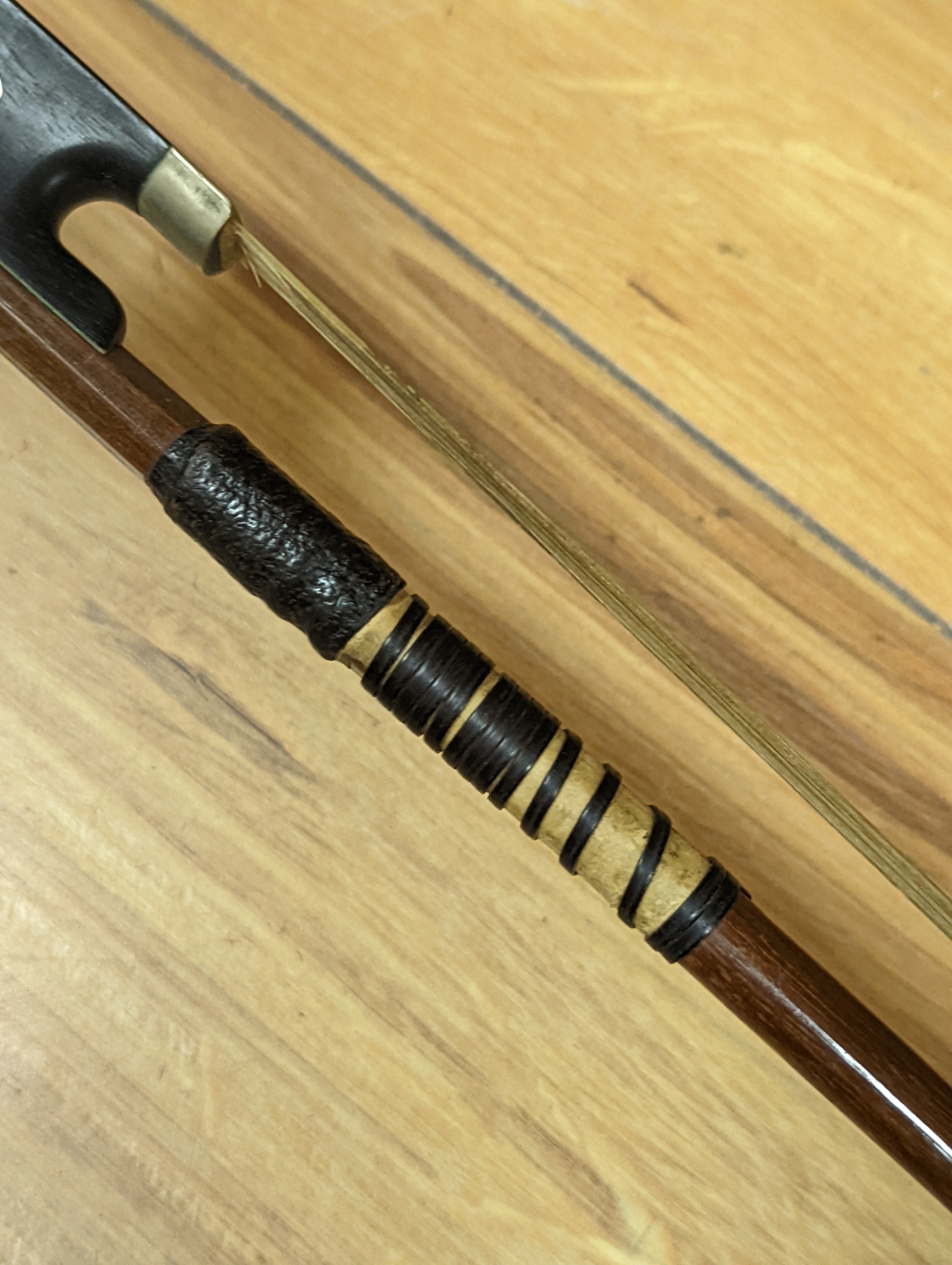 An early 20th century French vioilin, cased with bow and a cased saxon violin